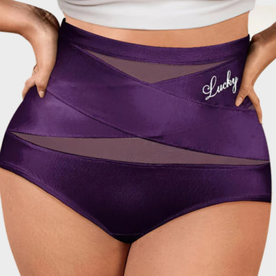 Slip modellante vita alta Saymika viola scuro indossato, fascia incrociata a X sul ventre