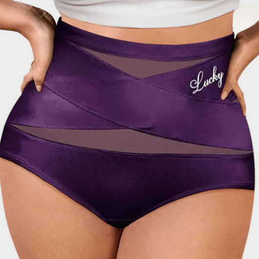 Slip modellante vita alta Saymika viola scuro indossato, fascia incrociata a X sul ventre